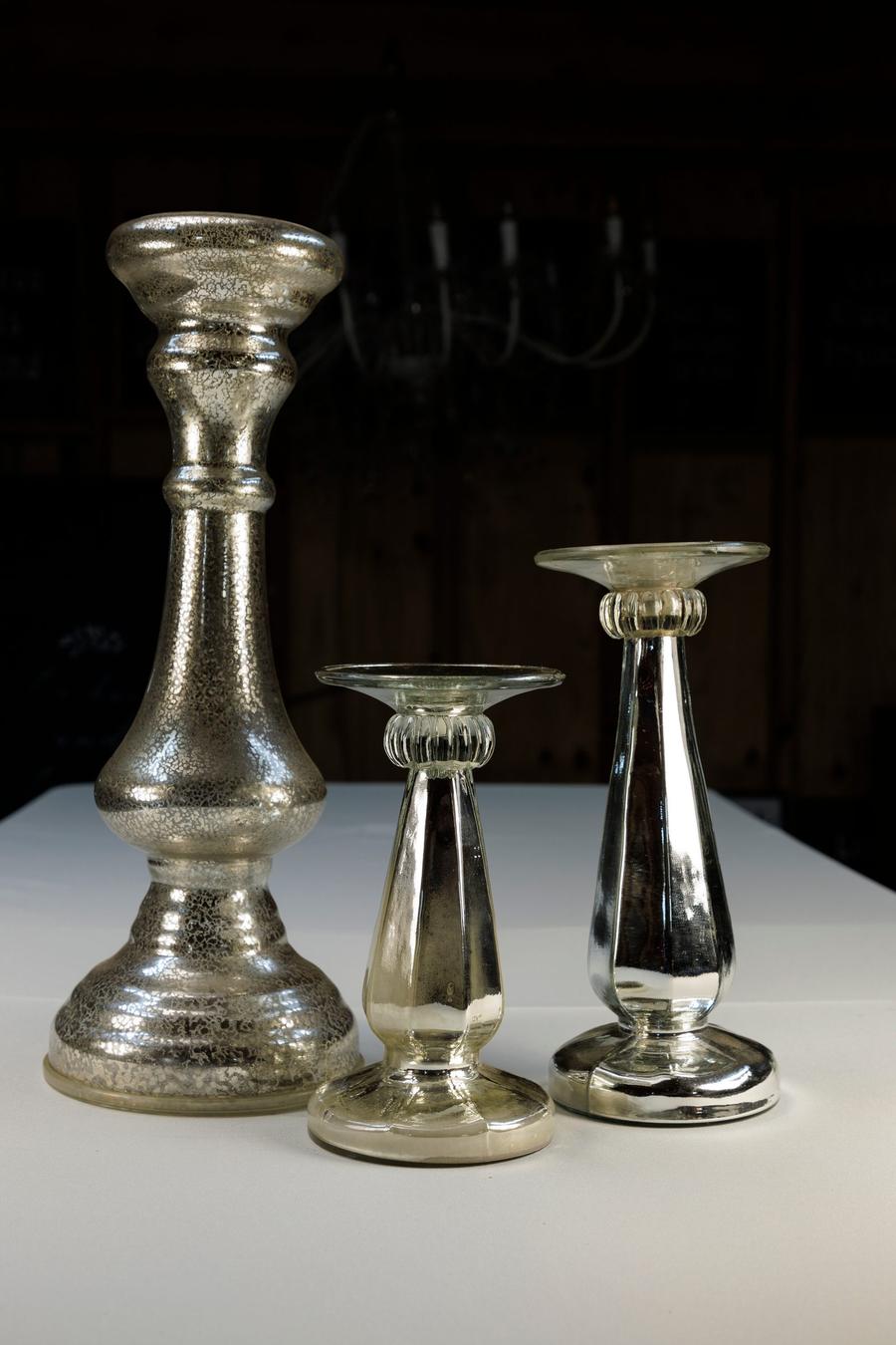 Mercury glass pillar candle holders in assorted heights.